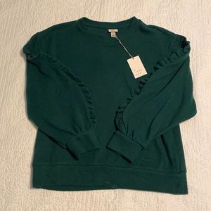 A New Day green sweater